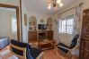 Living room with fireplace of this farm in Alhaurín el Grande