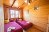 Bedroom of this wooden house in Alhaurín el Grande